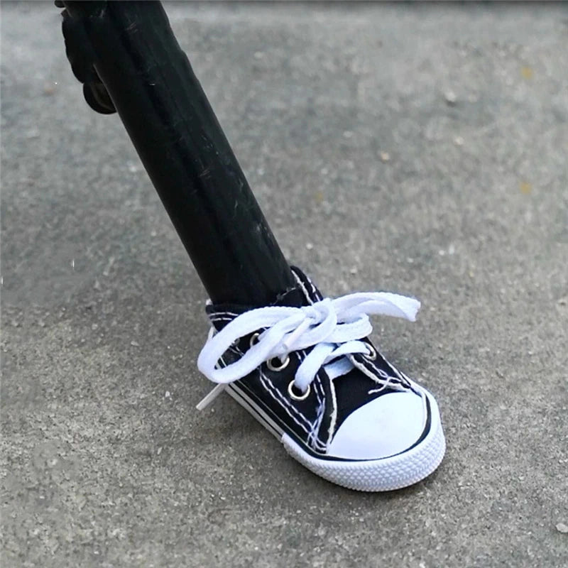 Close-up of a black sneaker-shaped kickstand cover fitted on a kickstand.