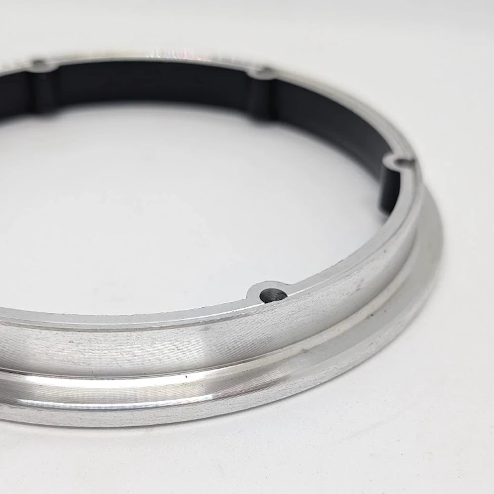 Close-up of rear bolt hole detail on scooter motor rim