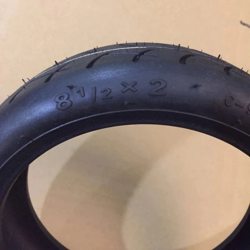 8.5-inch CST upgraded tyre for Xiaomi M365 Pro, extra thick rubber, marked with 8 1/2 x 2 size and model details.
