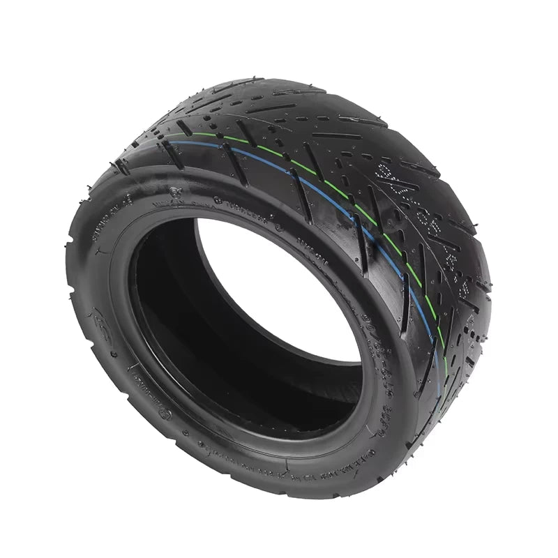 Hero shot of CST 90/65-6.5 self-healing road tyre for electric scooters, showcasing sidewall branding, aggressive road tread, and sealing layer inside.