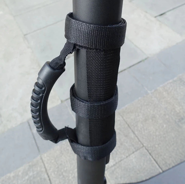 Close-up view of electric scooter handle attachment - ergonomic grip and secure fit.