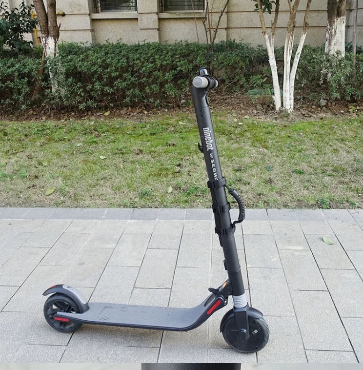 Ninebot by Segway electric scooter with fitted portable carrying strap, enhancing convenience for easy transport.