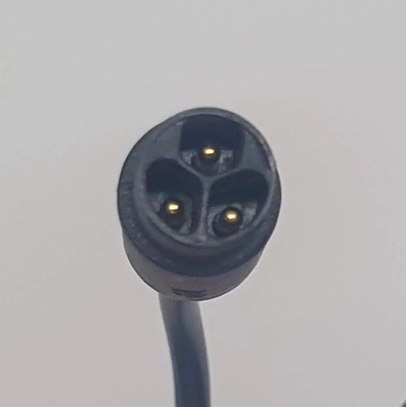 Close-up of 3-pin charging connector for Charger (63V 1.8A)/AC Power Adapter for Inmotion/Dualtron - shows precise plug type for potential buyers to verify product compatibility.