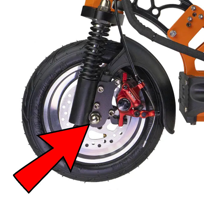 Front wheel of the EMOVE Cruiser highlighting the location of the Dome Nut for the Front Wheel Axle.