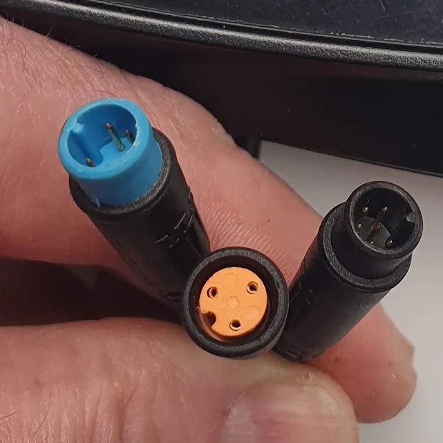 Close-up view of the replacement Hex Diamond LCD cable connectors featuring 3-pin and 4-pin connectors for Bexly Blackhawk and Apollo Phantom V2 scooters.