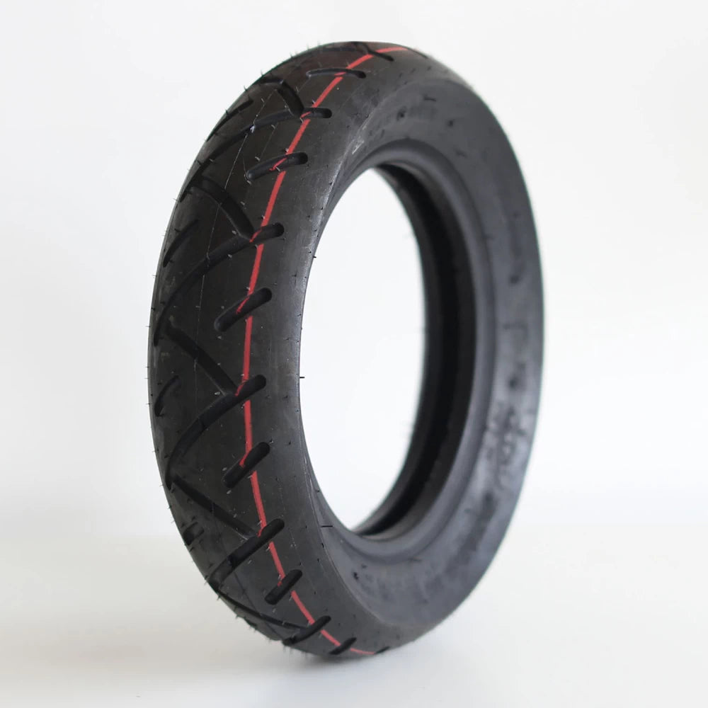 Hero shot of the 10 x 3.0 electric scooter road tyre with red line and versatile tread pattern.