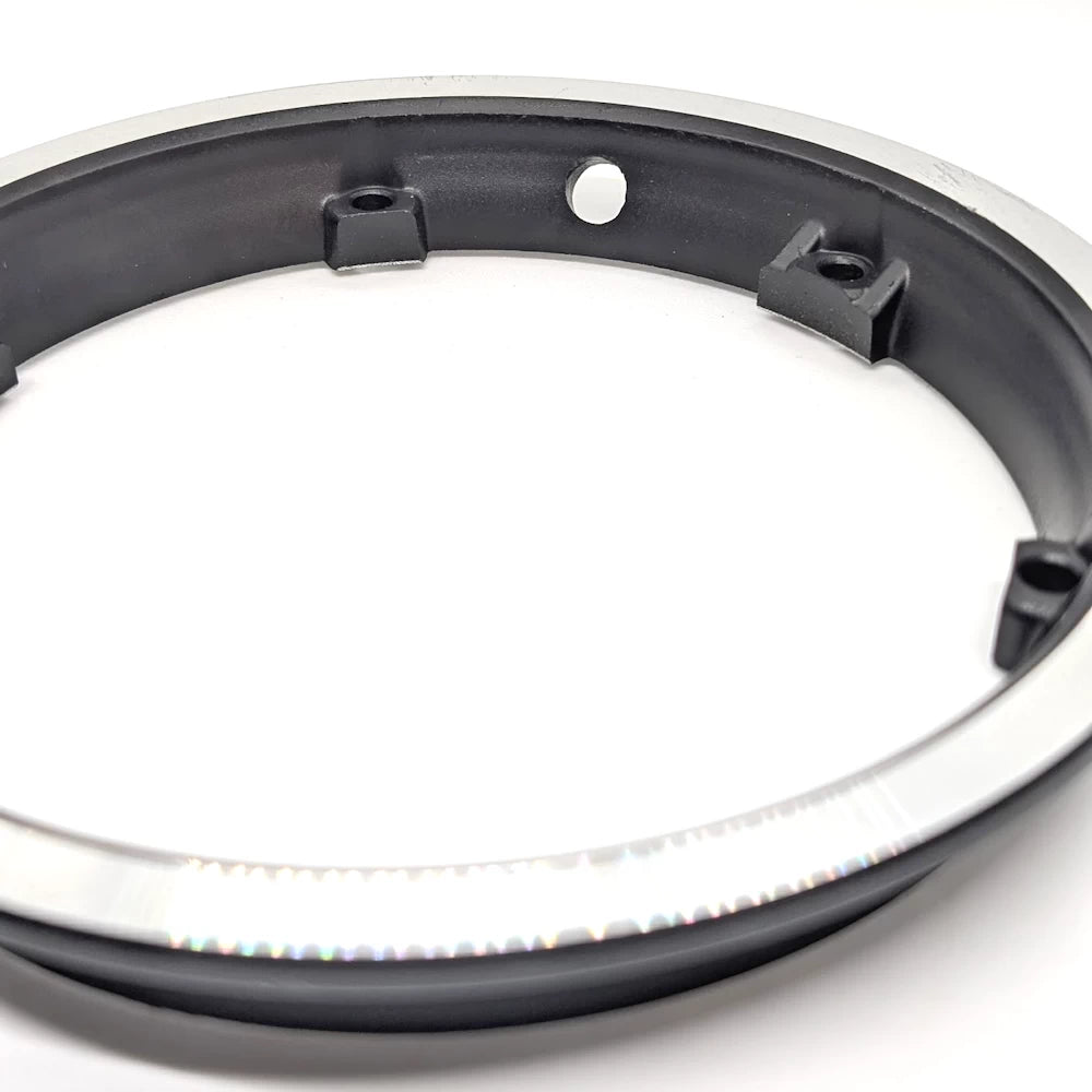 Detail of valve stem hole and inner black mounting surface.