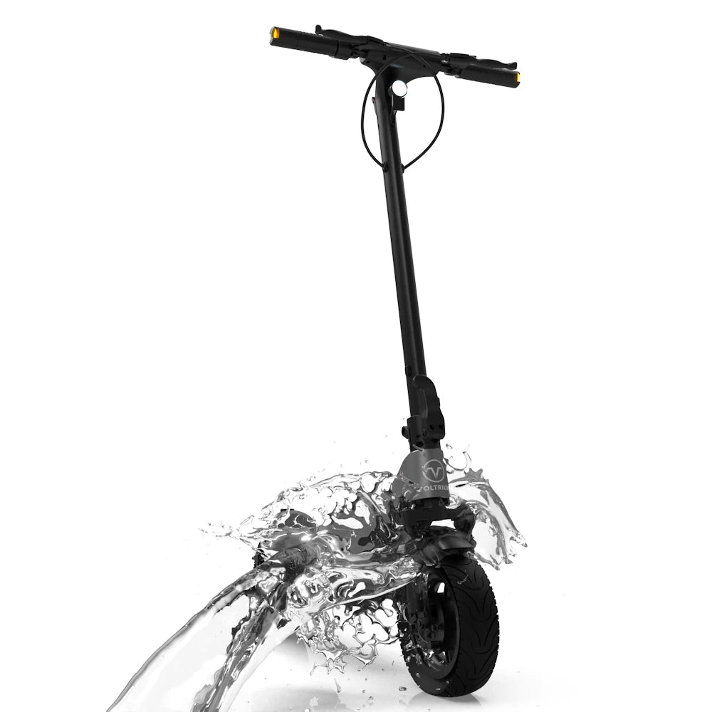 Voltrium ION Max being splashed by water, demonstrating its IPX5 water resistance and durable design for all-weather commuting.