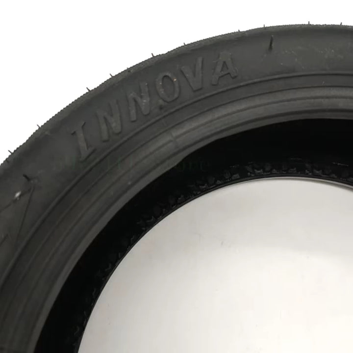 Close-up of the INNOVA brand name imprinted on the 10-inch tubeless tyre for Ninebot Max and other scooters.