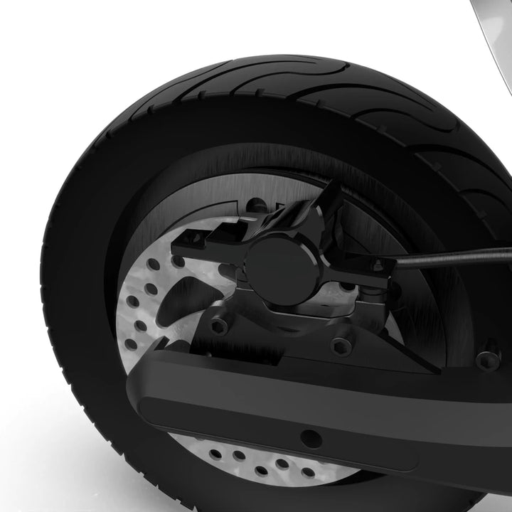 Rear wheel of the ION Max scooter, showing the brake mechanism and without the rear fender installed.