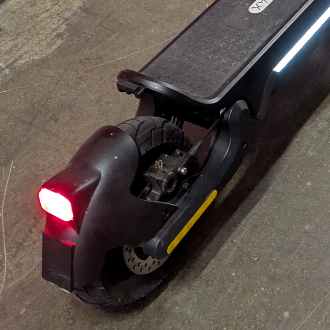 Close-up view of the rear hydraulic brake caliper of the Ex-Demo Voltrium ION Max Dual motor electric scooter