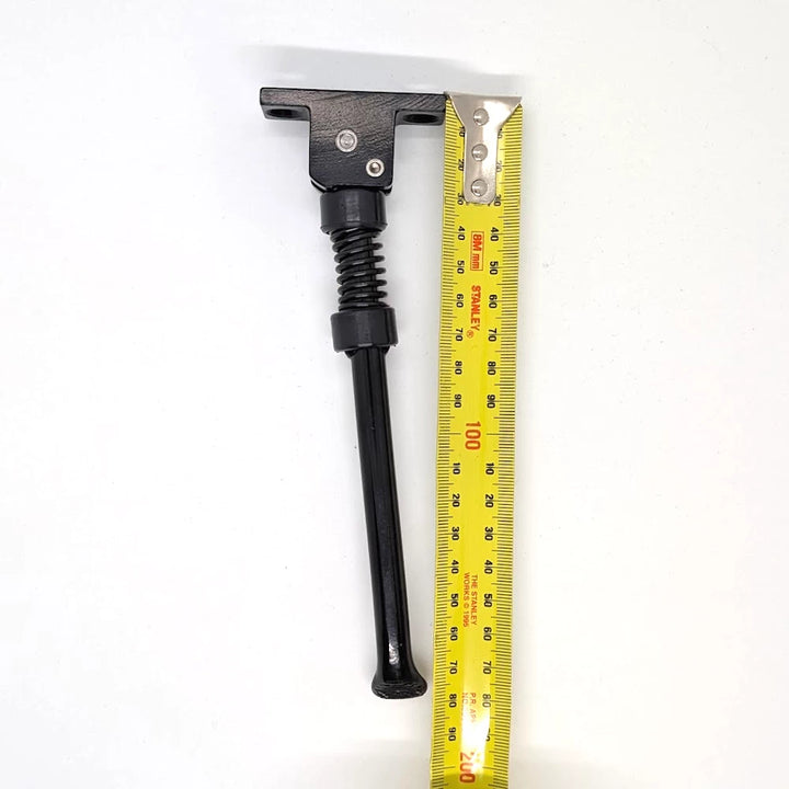 Dualtron Mini electric scooter kickstand side view with measuring tape indicating total length of approximately 180mm.