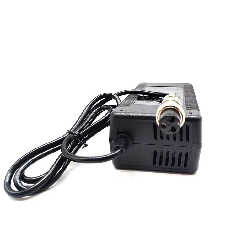 Angled rear view of Kugoo M5 charger showing vented housing, output lead and female GX16 connector plug.