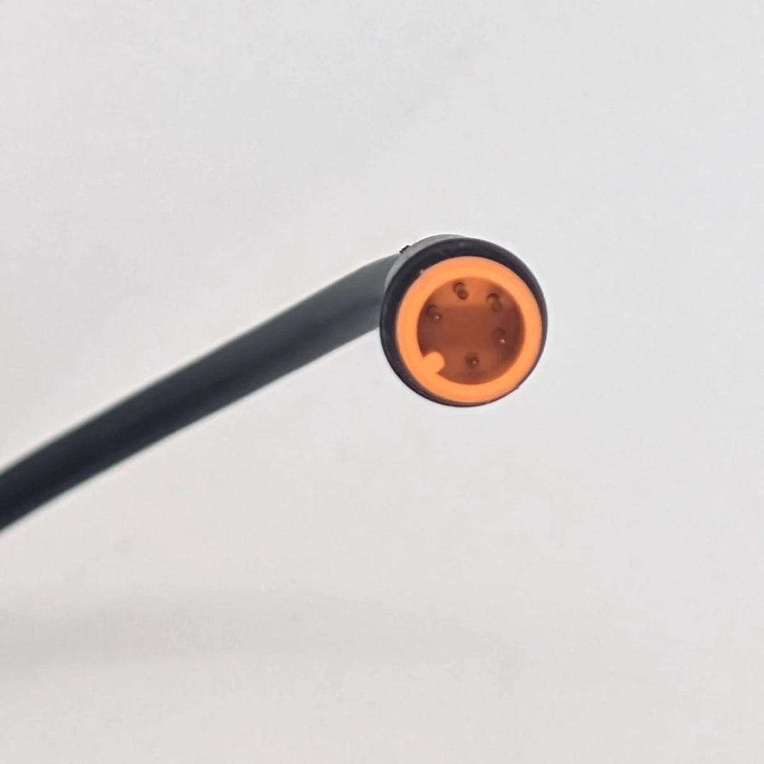 Close-up of 5-pin male orange Julet waterproof connector for OEM light turn signal and sport mode switch for Bexly Blackhawk and Apollo Phantom V2.