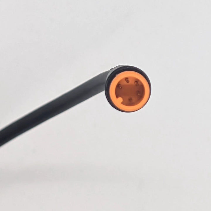 Close-up of 5-pin male orange Julet waterproof connector for OEM light turn signal and sport mode switch for Bexly Blackhawk and Apollo Phantom V2.