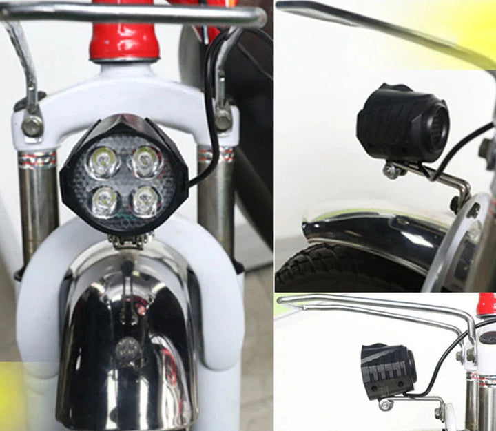 Front view of 12V-80V 12W e-bike light with integrated horn, installed on the front fork of an e-bike. The light features four bright LEDs for optimal night visibility and a durable, corrosion-resistant mount.