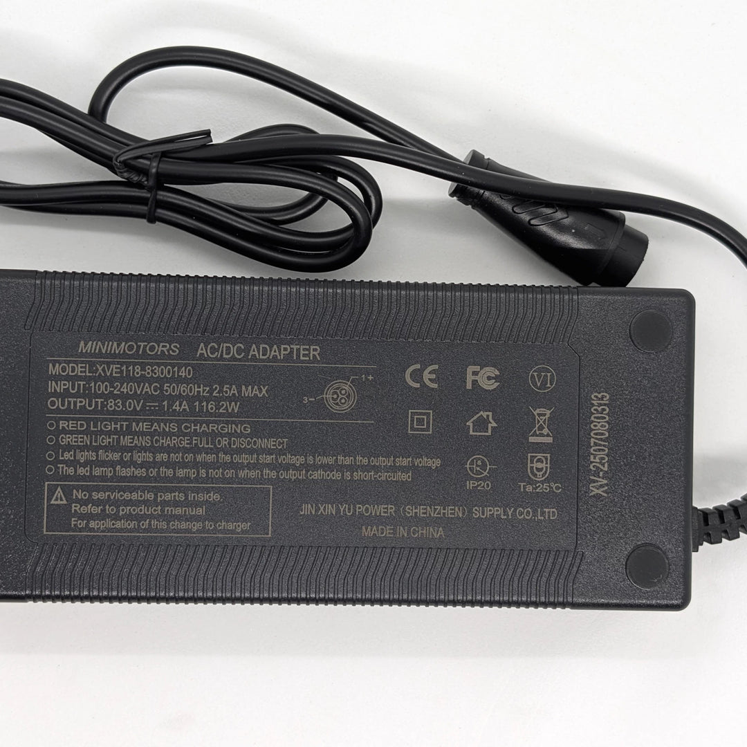 Minimotors XVE118-8300140 charger label showing 83V 1.4A 116.2W output and CE and FCC Certification.