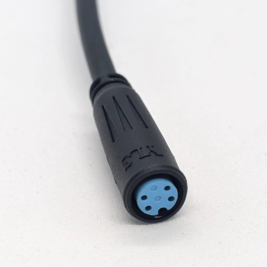 Close-up view of 4-pin female blue waterproof Julet connector on OEM Mode-Up-Down switch for Bexly Blackhawk and Apollo Phantom V2.