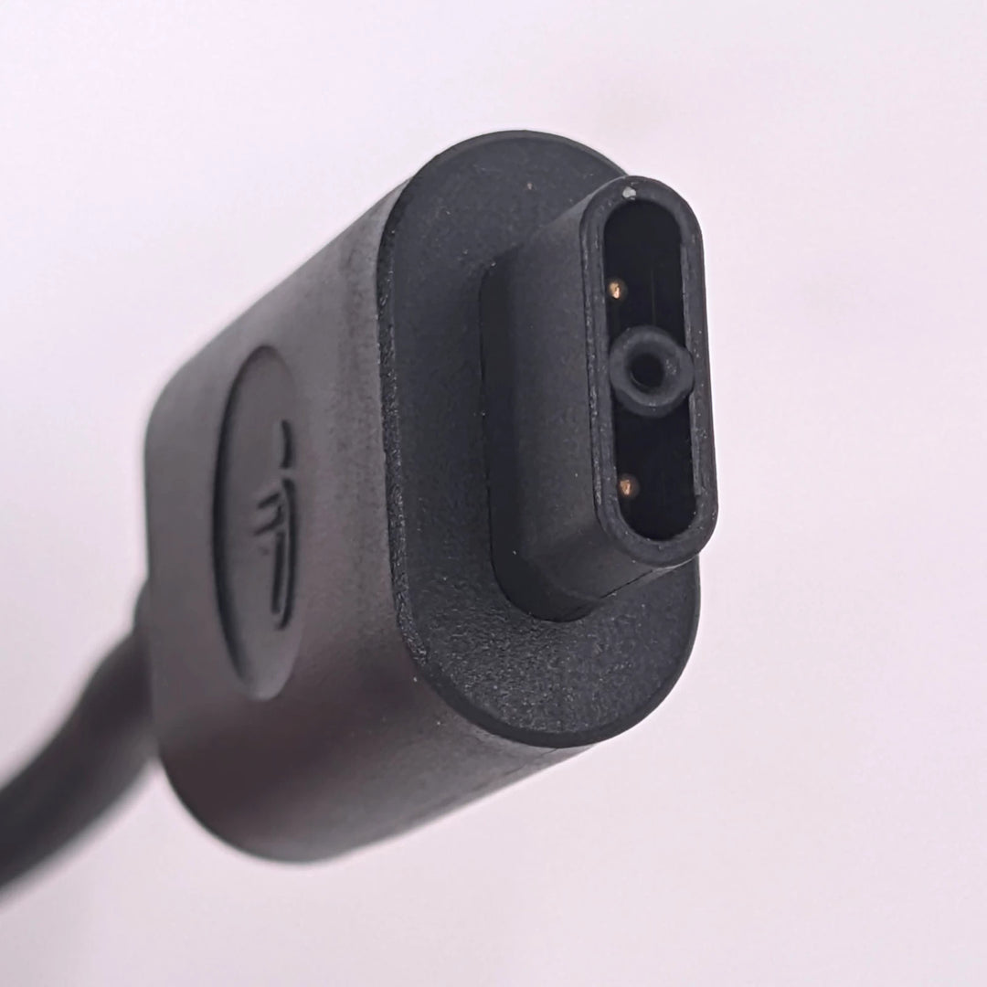 Detail view of the flat-square 2-pin charging connector of the Segway Ninebot GT1 and GT2 charger.