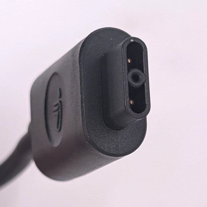 Detail view of the flat-square 2-pin charging connector of the Segway Ninebot GT1 and GT2 charger.