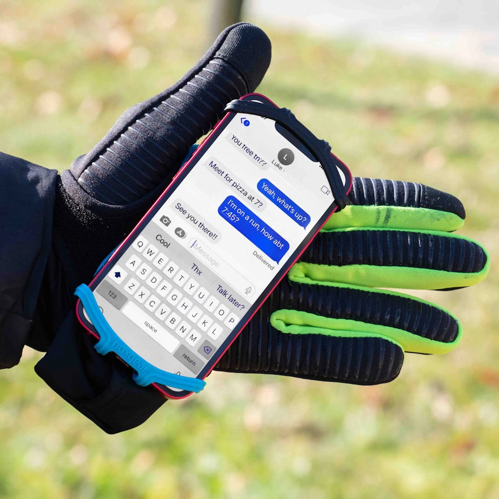 Runner wearing gloves using NoxGear Phone Holder outdoors