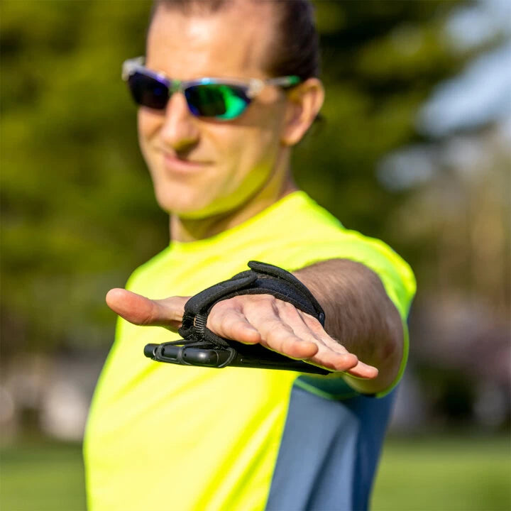 Male runner demonstrating secure fit of NoxGear Phone Holder outdoors