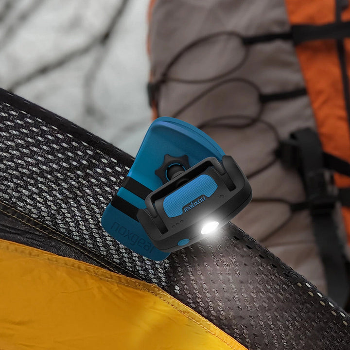 Noxgear 500 lumen Clip Anywhere rechargeable light clamped to camping tent