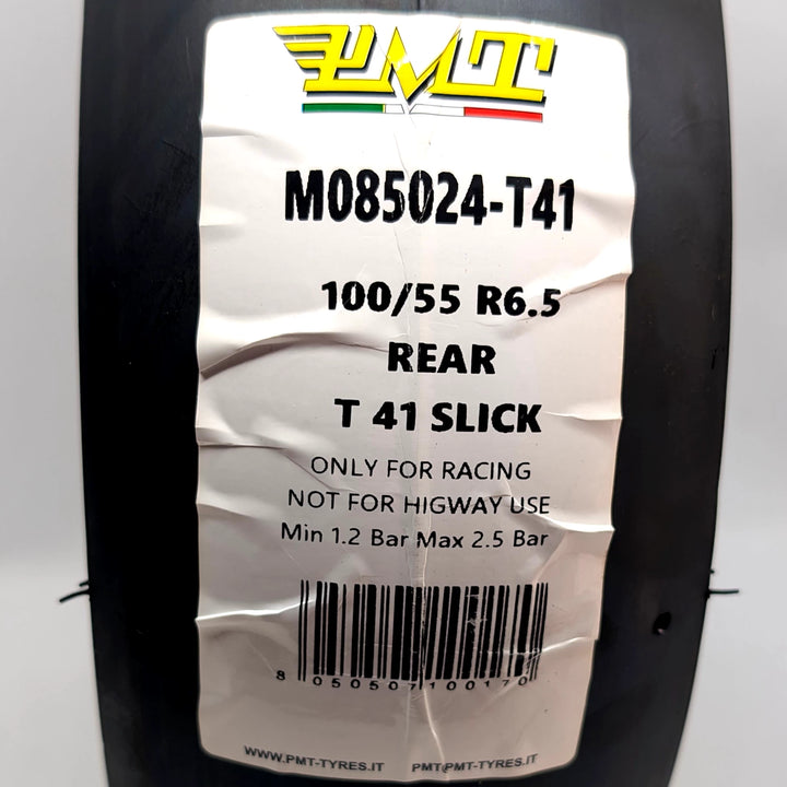 CLose-up of the label on the PMT 100/55-6.6 T41 Slick tyre, Made in Italy.