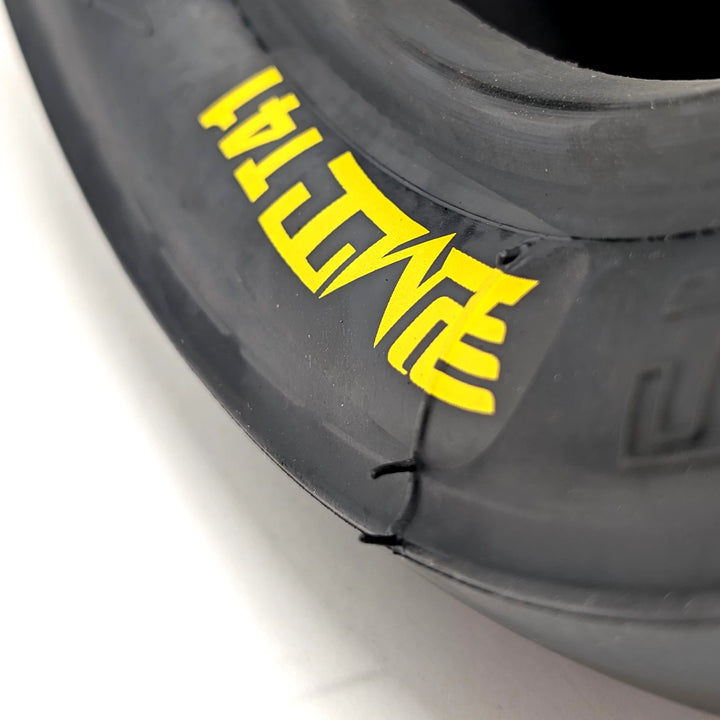 Close up of the yellow PMT T41 logo on the sidewall of the 100/55-6.6 T41 Slicks