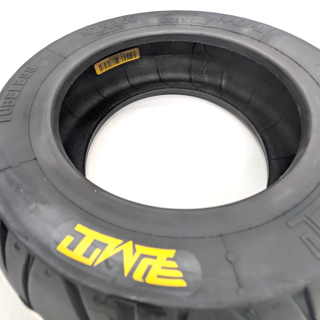 Inside view of the PMT 10x3.50 (85/250 R6.0) E-Fire Tyre, showing the individual tyre product barcode and inner radial construction