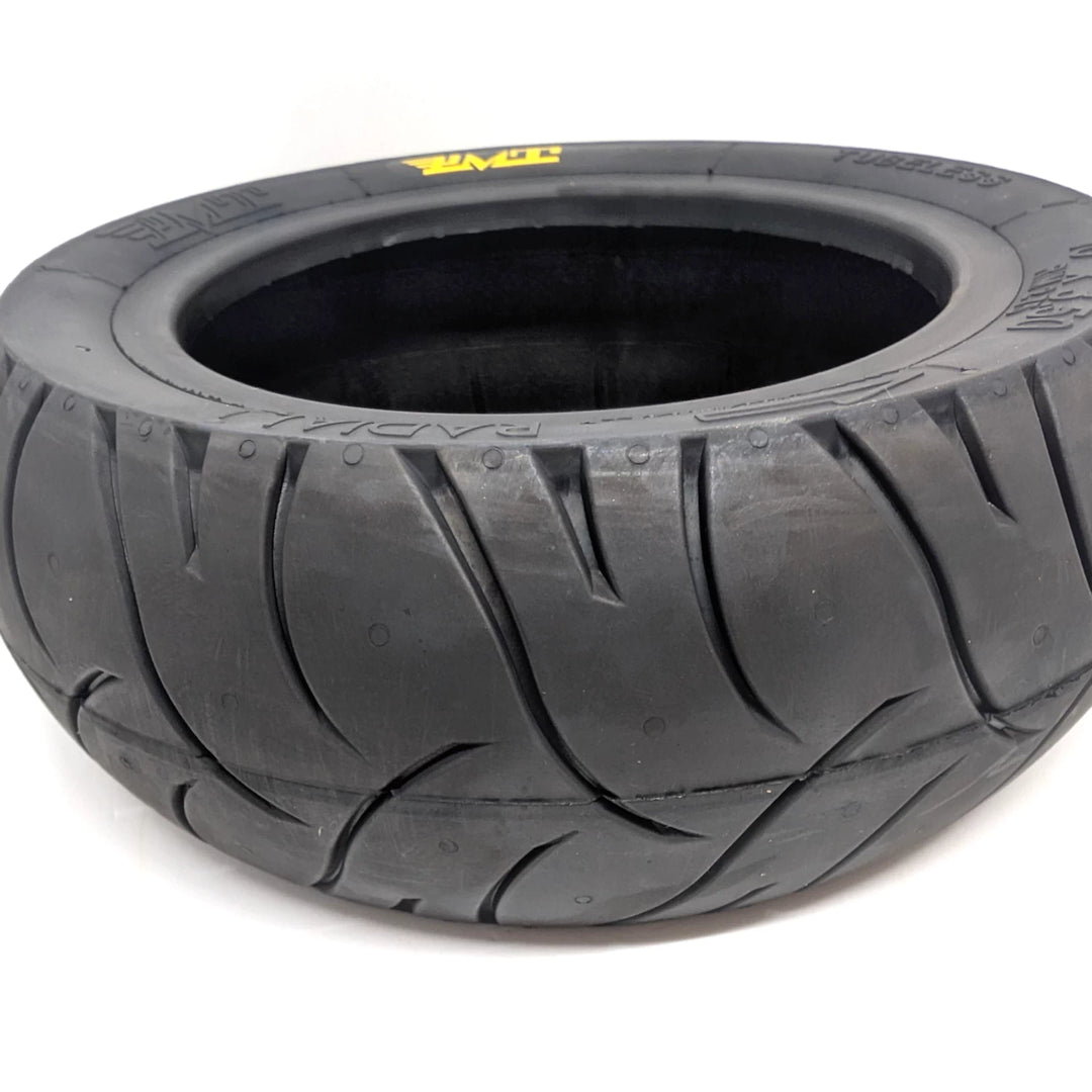 Close-up view of the Stradale tread pattern on the PMT 10x3.50 (85/250 R6.0) E-Fire Radial Scooter Tyre, made in Italy.