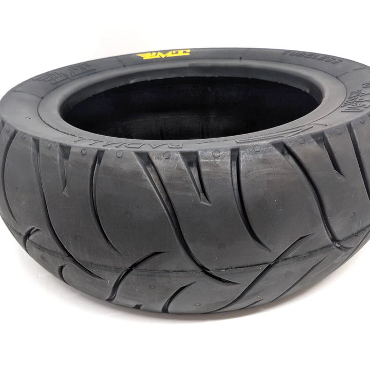 Close-up view of the Stradale tread pattern on the PMT 10x3.50 (85/250 R6.0) E-Fire Radial Scooter Tyre, made in Italy.