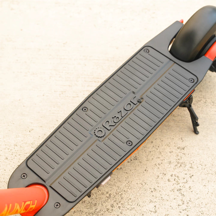 Top view of the Razor PowerCore Launch scooter deck, featuring a non-slip surface and Razor logo for enhanced grip during rides.