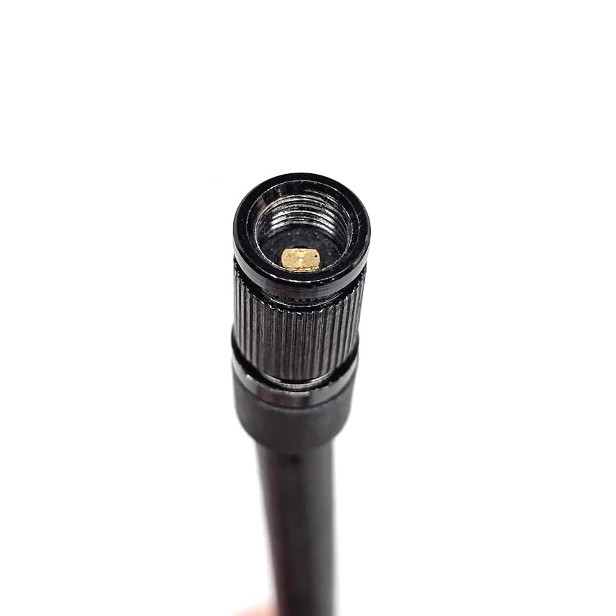 Close view of threaded Schrader end and rubber hose body.