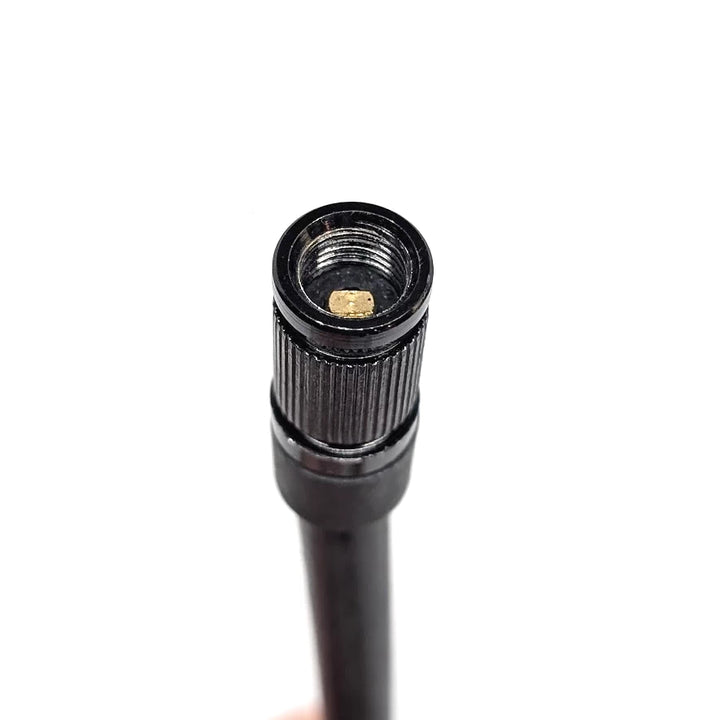 Close view of threaded Schrader end and rubber hose body.