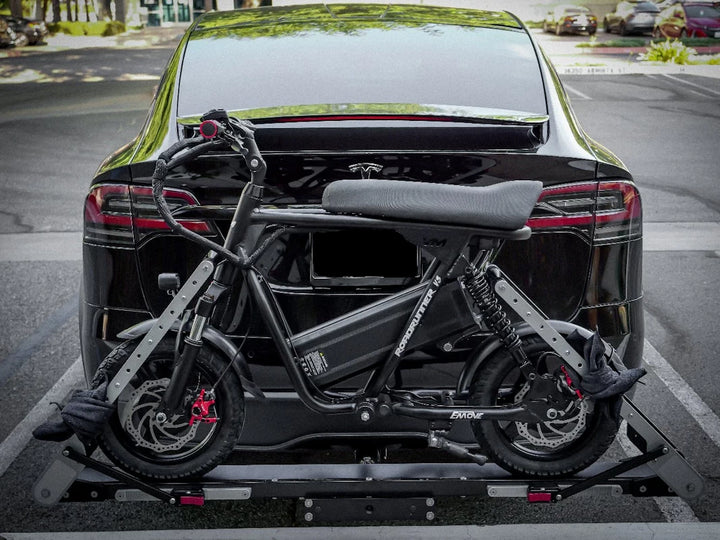 Roadrunner V3 stowed on a rear bike rack mounted on a SUV.