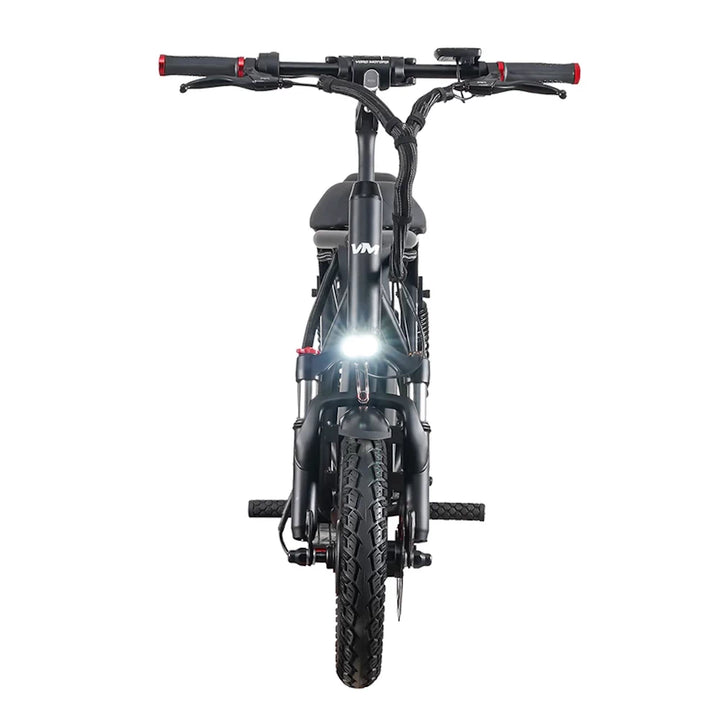 Front view of the EMOVE Roadrunner V3 with the headlight turned on, emphasizing visibility and safety features for night riding.