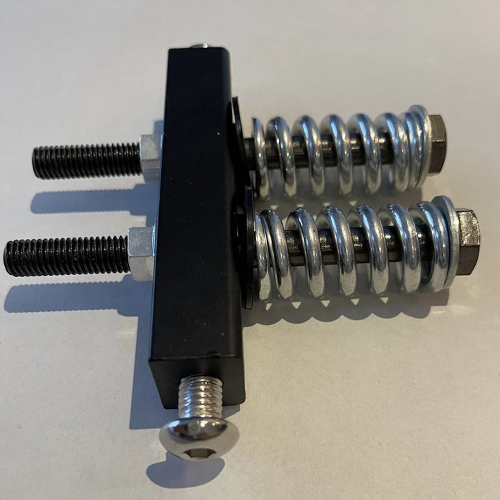 Complete rear suspension set with block and springs for EMOVE Touring electric scooter.