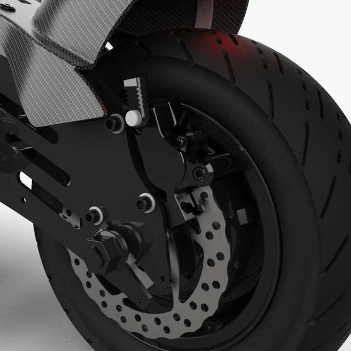 Close-up of the rear wheel featuring the dual-piston hydraulic brake and heavy-duty rotor.