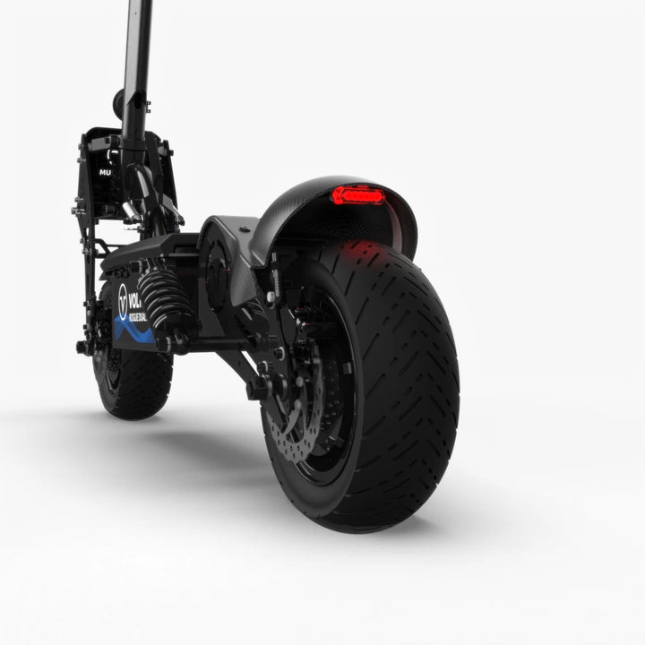 Low-angle rear-quarter shot of the Rogue Gen2, displaying the rear tyre, suspension, and brake setup.