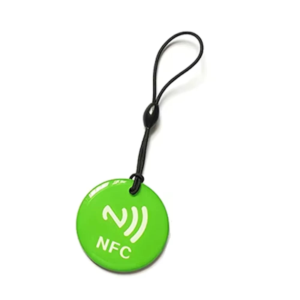 Green NFC tag token with rope, compatible with NFC-enabled devices, designed for electric scooter protection and access control.