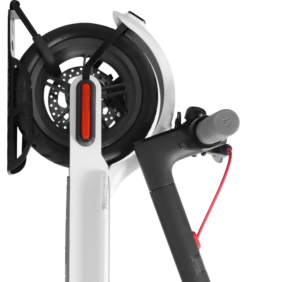 Close-up showing how the foam-covered hook supports the electric scooter wheel without scratching.