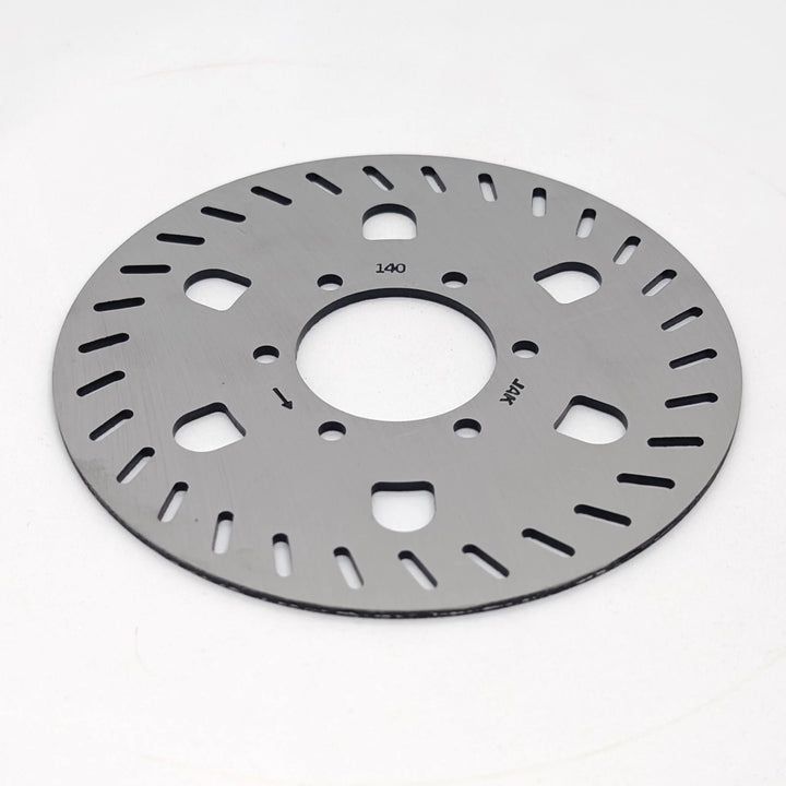 Low angle view of the Genuine Segway GT1 GT2 140mm stainless steel OEM disc brake rotor showing 6 bolt mounting holes and precision laser-cut cooling slots.