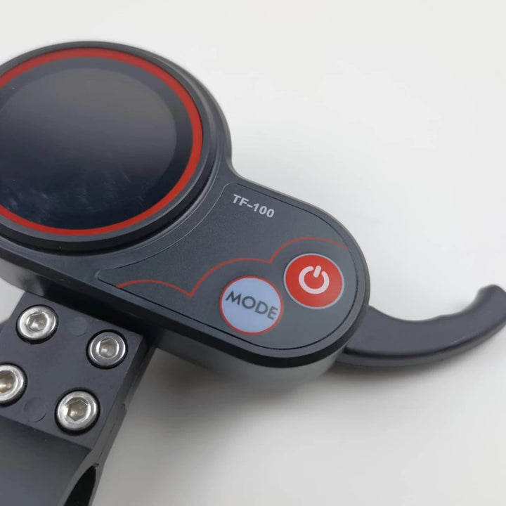 Close-up of the TF-100 throttle, highlighting the LCD screen, mode button, and power switch.