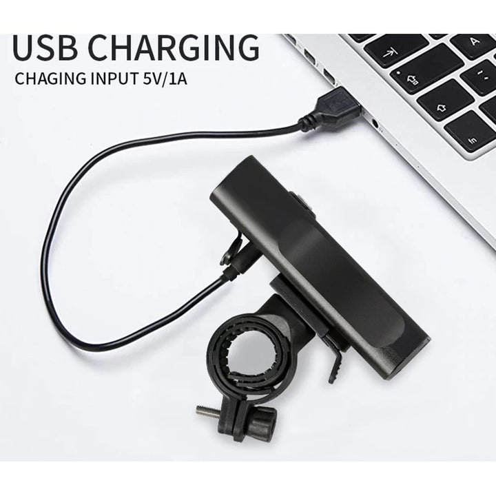 USB charging input for the TRLIFE bike light, showing it being charged via a laptop, emphasizing its convenient charging options.