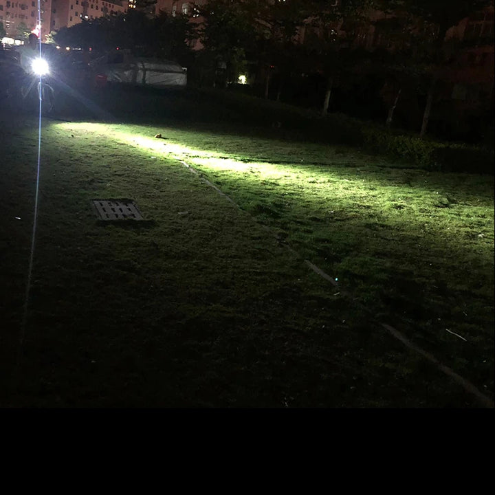 Long-range light throw demonstration of the TRLIFE LED Bike Light illuminating a vast grassy area at night, highlighting its strong brightness and wide coverage.