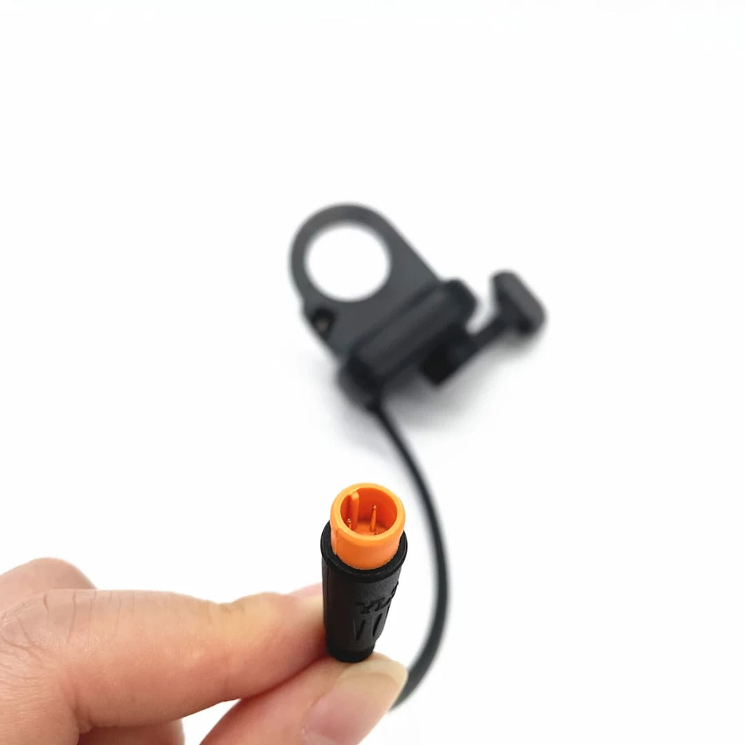 Close up of orange 3-pin Julet waterproof connector for 10bX-R thumb throttle accelerator