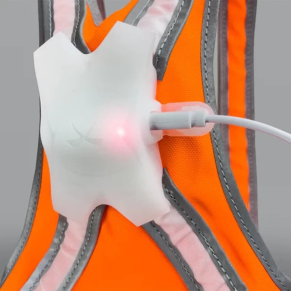 Close-up of the TracerJR LED safety vest’s USB-C charging port, showcasing the rechargeable LED system.