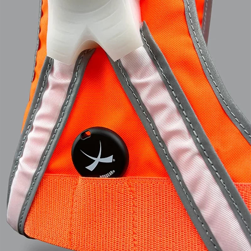 Close-up of the TracerJR LED safety vest’s tracker pocket with a black GPS tag visible, ensuring easy location tracking.