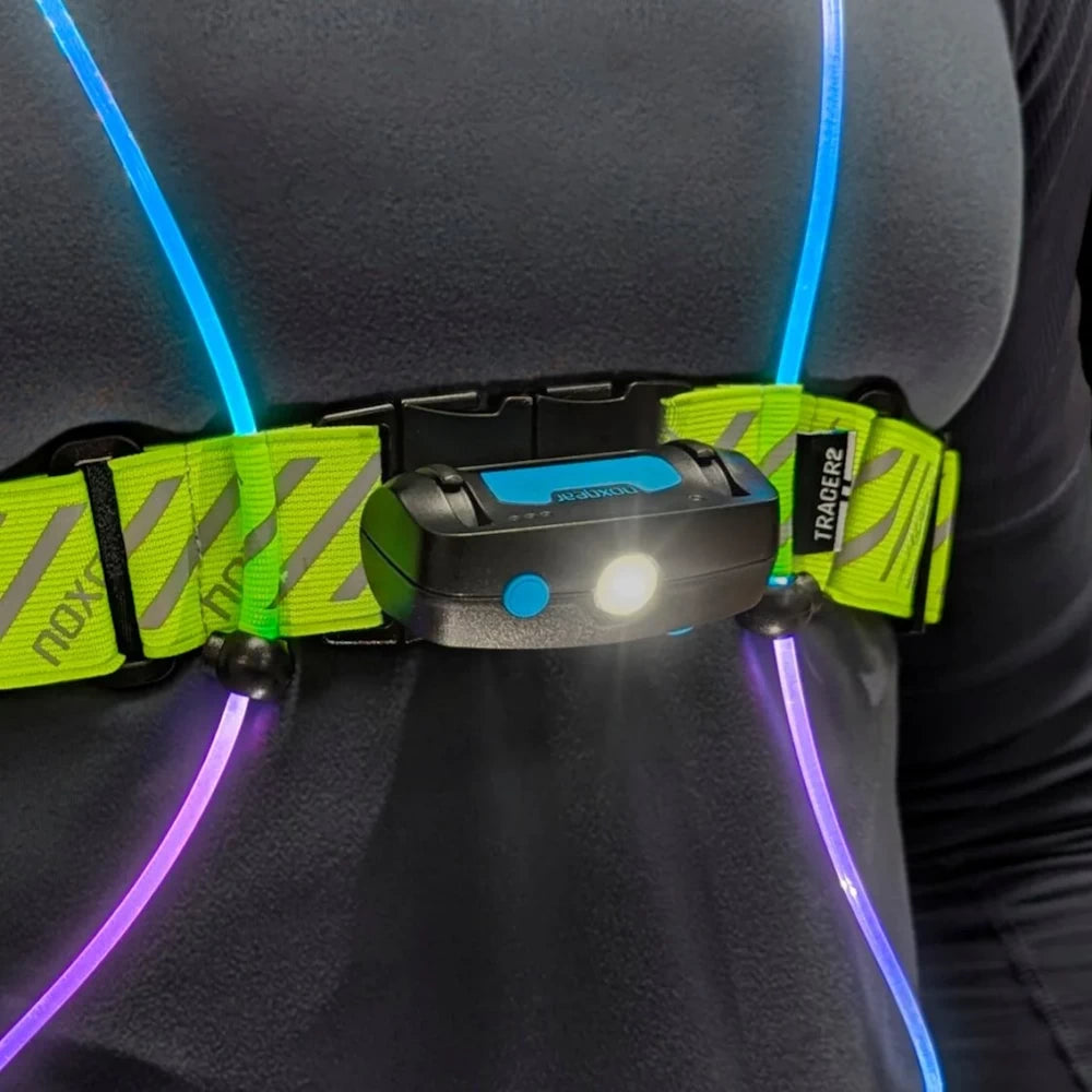 NoxGear Tracer Lamp in use on a person wearing the Tracer2 LED vest – nighttime visibility setup